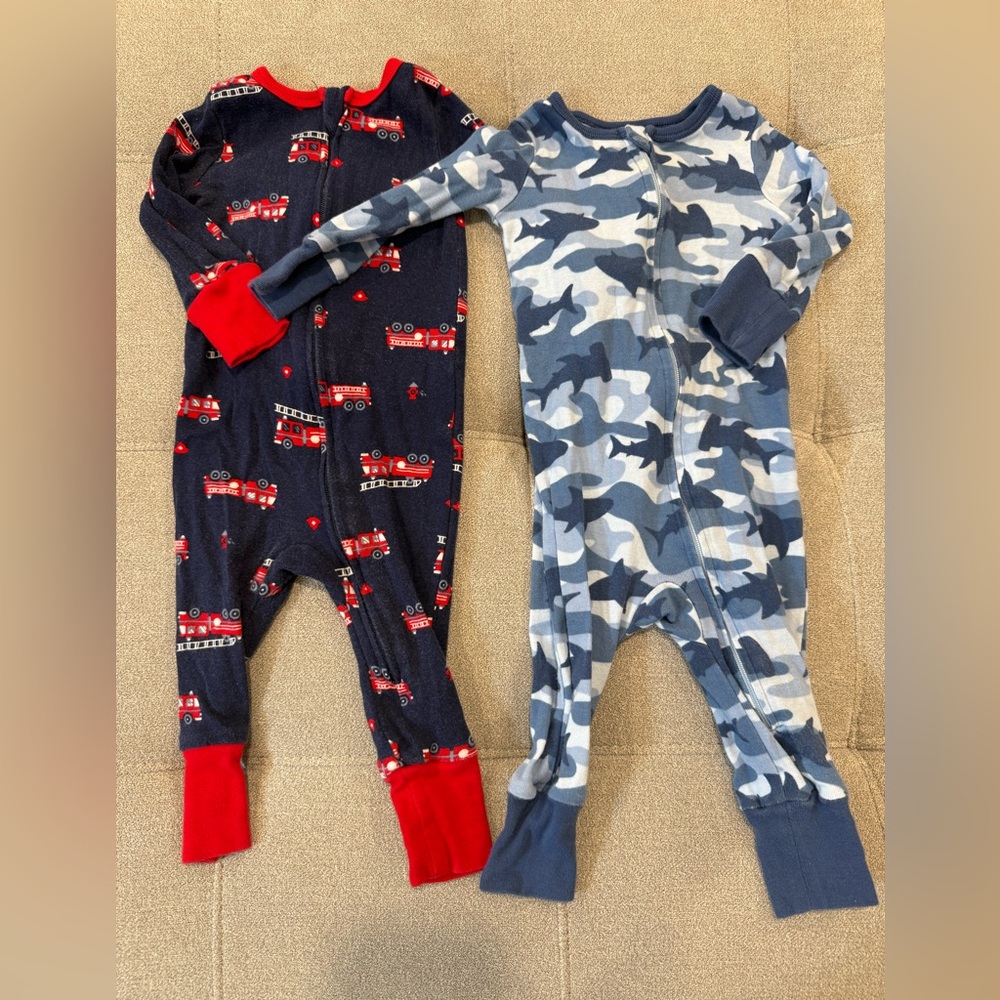 Two 9M footless onesies in charming fire truck and blue camo shark print